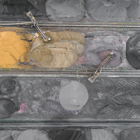 The surface mine storage place, mining minerals and brown coal in diferent colours. View from above....
