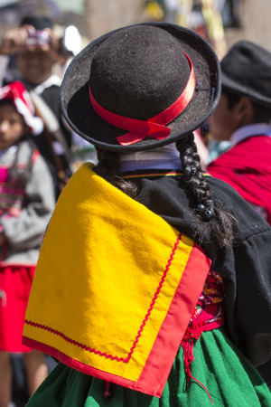 Puno, Peru - August 20, 2016: Native people from peruvian city dressed in colorful clothing perform traditional dance in a religious celebration. Peru, South America.のeditorial素材