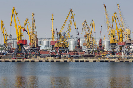 Odessa, Ukraine - July 30, 2016: Container cranes in cargo port terminal, cargo cranes without job in an empty harbor port. A crisis. Defaulted paralyzed entire economy of stateのeditorial素材