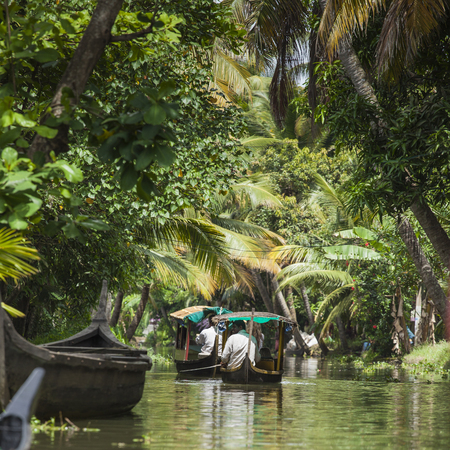 ALLEPPEY, KERALA, INDIA - AUGUST 16, 2016: Unidentified indian people in small boat in backwaters. Kerala backwaters are both major tourist attraction and integral part of local people life in Keralaのeditorial素材