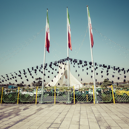 TEHERAN, IRAN - OCTOBER 03, 2016: Azadi Tower with flasgs of Iran, Tehran, Iranのeditorial素材