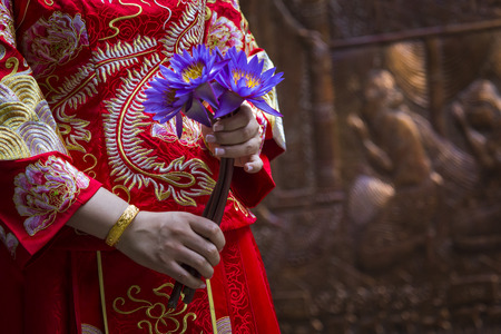 Woman hand respect to buddha statue.の写真素材