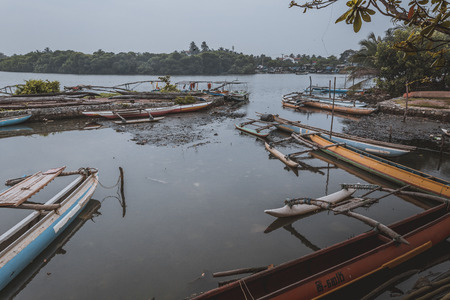 NEGOMBO, SRI LANKA - NOVEMBER 30: Local fishermen and their boats in the lagoon near the fish markets of Negombo, near Colombo, Sri Lanka on the 30 November, 2016のeditorial素材