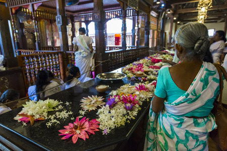 KANDY, SRI LANKA - DECEMBER 01:, 2016: Temple Of The Sacred Tooth RelicThe inside view. People bring flowers to the Temple. Kandy, Sri Lankaのeditorial素材