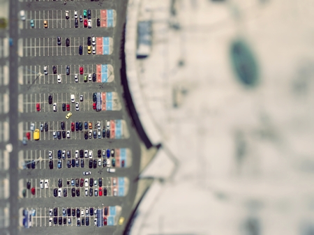 Supermarket roof and many cars in parking, viewed from above.の写真素材