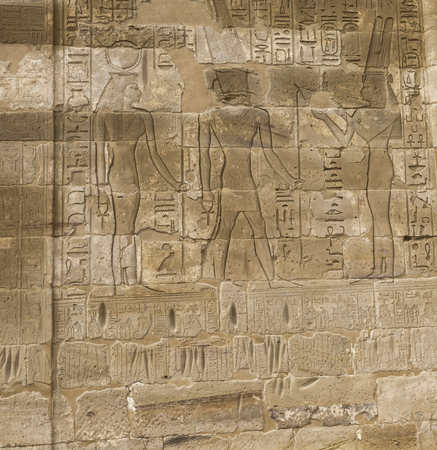 old egypt hieroglyphs carved on the stone