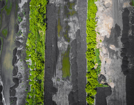Sewage farm. Static aerial photo looking down onto the clarifying tanks and green grass. Geometric background texture.の写真素材