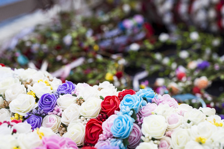 Colorful traditional flower wreath on sale on local market.