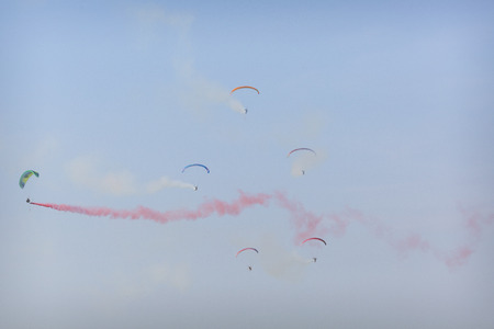 RADOM, POLAND - AUGUST 26, 2017 :The Flying Dragons aerobatic group of paramotor flying in the Air Show Radom 2017.のeditorial素材