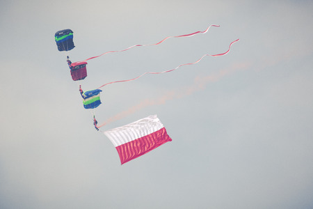 RADOM, POLAND - AUGUST 26, 2017 : Parachutist with the Polish flag during Air Show Radom 2017.のeditorial素材