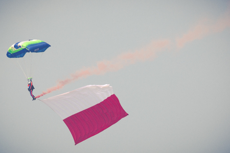 RADOM, POLAND - AUGUST 26, 2017 : Parachutist with the Polish flag during Air Show Radom 2017.のeditorial素材