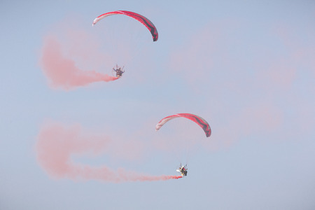 RADOM, POLAND - AUGUST 26, 2017 :The Flying Dragons aerobatic group of paramotor flying in the Air Show Radom 2017.のeditorial素材