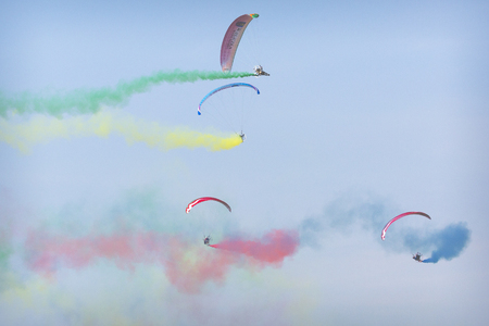 RADOM, POLAND - AUGUST 26, 2017 :The Flying Dragons aerobatic group of paramotor flying in the Air Show Radom 2017.のeditorial素材