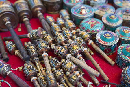 Tibetan praying objects for sale at a souvenir shop in Ladakh, India.の写真素材
