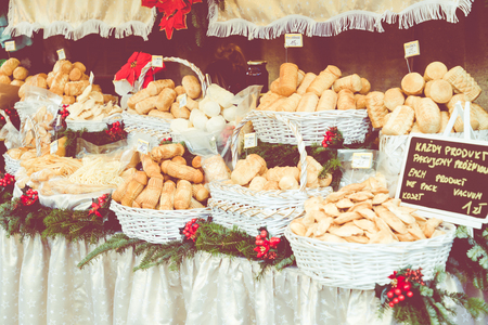 Traditional polish smoked cheese oscypek on Christmas market in Cracow, Poland.の写真素材