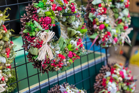 Christmas flowers wreaths decorations in Cracow Christmas market in Poland.の写真素材