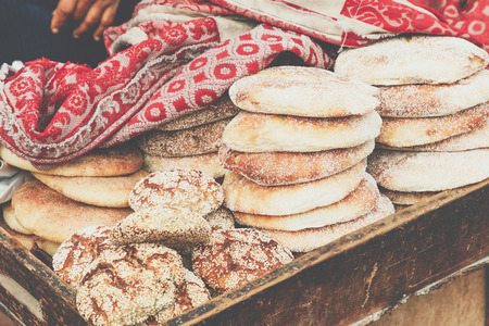 Typical traditional Moroccan bread sesame seeds on street food stall, Marrakesh, Moroccoの写真素材