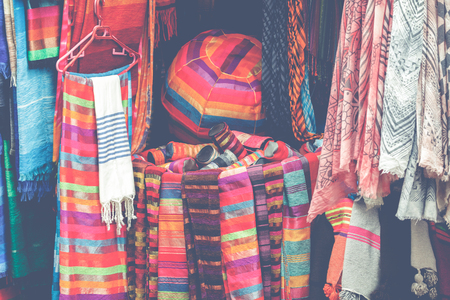 Selection of colorfu clothes on a traditional Moroccan market (souk) in Marrakech, Moroccoの写真素材