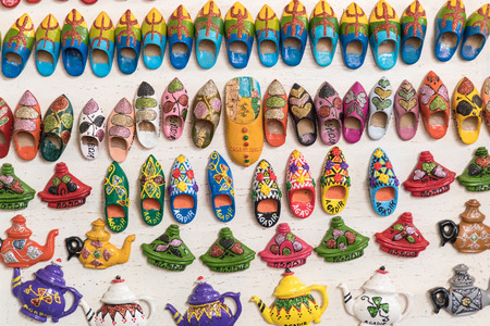 Souvenir fridge magnets for sale representing Morocco.