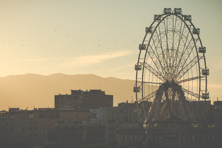 Looking towards the Ferris Wheel Called "Malaga Big Wheel" ("Noria de Malaga"). Andalusia, Spain.の写真素材