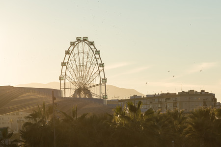 Looking towards the Ferris Wheel Called "Malaga Big Wheel" ("Noria de Malaga"). Andalusia, Spain.の写真素材