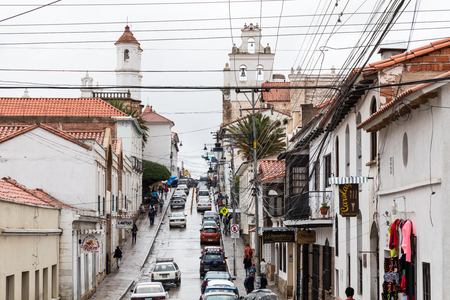 SUCRE, BOLIWIA - FEBRUARY 08, 2018: Street in Sucre. Sucre is the constitutional capital of Bolivia. Traditional colonial architecture, white houses.のeditorial素材