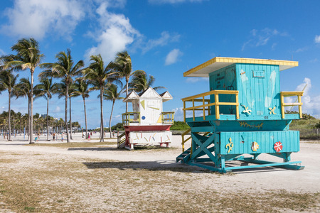USA, FLORIDA, MIAMI. February 18, 2018. Lifeguard tower in a colorful Art Deco style, with blue sky and Atlantic Ocean in the background. World famous travel location. Miami Beach.のeditorial素材