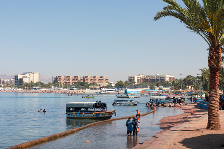 AQABA, JORDAN - MARCH 19, 2018: Touristic ships on the beach of Aqaba, Jordan. Popular resort,...