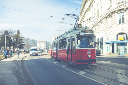 VIENNA, AUSTRIA - MARCH 10, 2018: Old red tram in the streets of historic old town of Vienna.