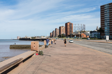 MONTEVIDEO, URUGUAY - FEBRUARY 03, 2018: People fishing at boulevard in Montevideo, Uruguay. Montevideo is the capital and the largest city of Uruguayのeditorial素材