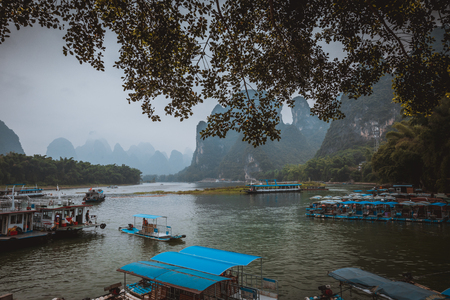 Li River (Lijiang River). Pleasure boats at the pier in Xingping Town, China.のeditorial素材