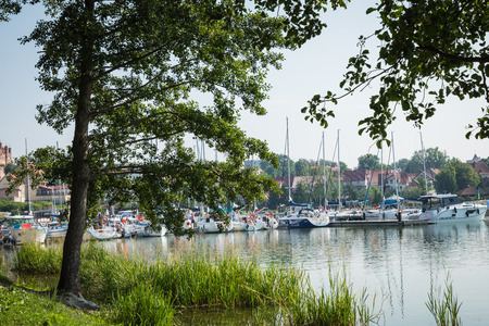 RYN, WARMIA-MASURIA PROVINCE / POLAND - JULY 31, 2018: Marina and pier on Rynskie lake, town of Ryn.