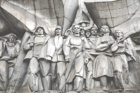 MINSK, BELARUS - SEPTEMBER 12, 2018: Bas-relief of the Soviet era on old facade building on Nemiga...