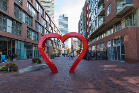TORONTO, CANADA - SEPTEMBER 18, 2018: Distillery District (former Gooderham & Worts Distillery) - historic and entertainment precinct. It contains numerous cafes, restaurants, shops and industrial parts.のeditorial素材