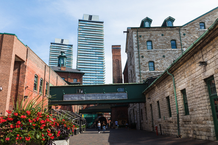 TORONTO, CANADA - SEPTEMBER 18, 2018: Distillery District (former Gooderham & Worts Distillery) - historic and entertainment precinct. It contains numerous cafes, restaurants, shops and industrial parts.のeditorial素材