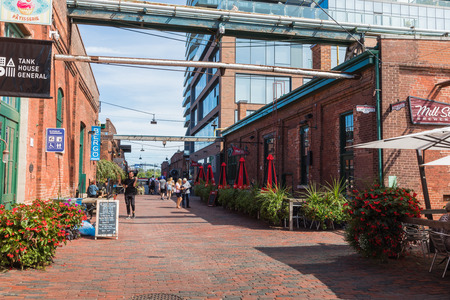 TORONTO, CANADA - SEPTEMBER 18, 2018: Distillery District (former Gooderham & Worts Distillery) - historic and entertainment precinct. It contains numerous cafes, restaurants, shops and industrial parts.のeditorial素材