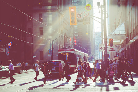TORONTO, CANADA - SEPTEMBER 17, 2018: Rush hour atToronto's busiest intersections. Financial district at the background.のeditorial素材
