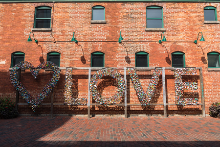 TORONTO, CANADA - SEPTEMBER 18, 2018: Distillery District (former Gooderham & Worts Distillery) - historic and entertainment precinct. It contains numerous cafes, restaurants, shops and industrial parts.のeditorial素材