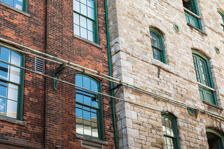 TORONTO, CANADA - SEPTEMBER 18, 2018: Distillery District (former Gooderham & Worts Distillery) - historic and entertainment precinct. It contains numerous cafes, restaurants, shops and industrial parts.のeditorial素材