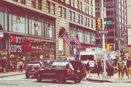 NEW YORK - SEPTEMBER 2, 2018: New York City street road in Manhattan at summer time, many cars, yellow taxis and busy people walk to work.のeditorial素材
