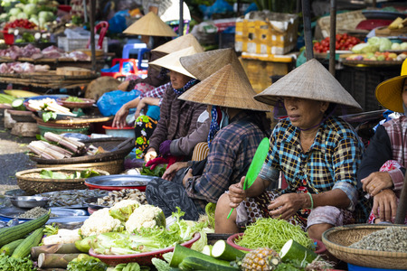 HUE, VIETNAM - NOVEMBER 19,2018: Sellers on the local market in Vietnam. Traditional food market in Hue, Vientam.のeditorial素材