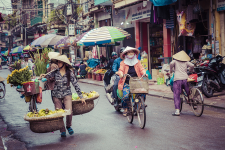 HAI PHONG, VIETNAM - NOVEMBER 12, 2018: People at busy morning street in Hai Phong, Vietnam.のeditorial素材