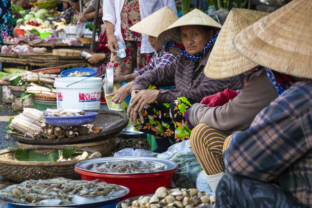 HUE, VIETNAM - NOVEMBER 19,2018: Sellers on the local market in Vietnam. Traditional food market in Hue, Vientam.のeditorial素材