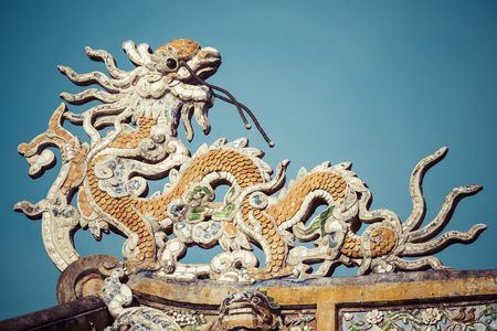 Detailed view of dragons on Citadel the Imperial City with the Purple Forbidden City in Hue, Vietnam.の写真素材
