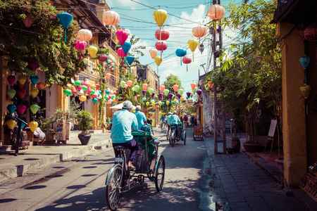 HOI AN, VIETNAM - NOVEMBER 21, 2018: Hoian Ancient town houses. Colourful buildings with festive silk lanterns. UNESCO heritage site. Vietnam.のeditorial素材