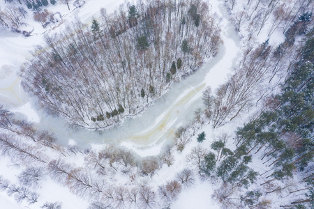 Aerial view of frozen lake.  Winter scenery. Landscape photo captured with drone above winter wonderland. Poland.の写真素材