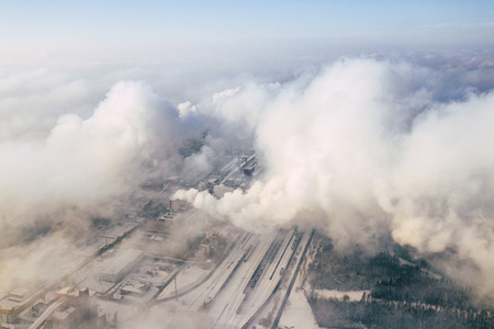 Aerial view of modern combined heat and power plant. Fuming chimney. Heavy industry from above. Power and fuel generation in Poland.の写真素材