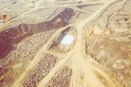 Aerial view of sandpit and factory plant producing sand materials for construction industry. Top view of industrial place. Photo captured with drone.の写真素材