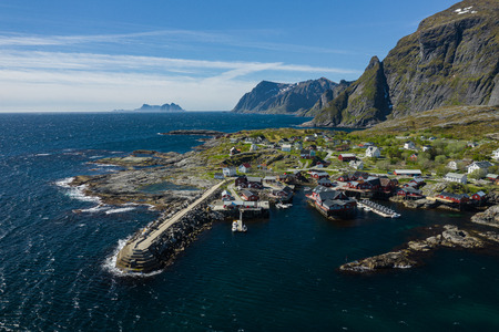 Aerial view of Tind. Lofoten islands. Norway. The fishing village of Reine. Spring time in Nordland. Blue sky. View from above.の写真素材