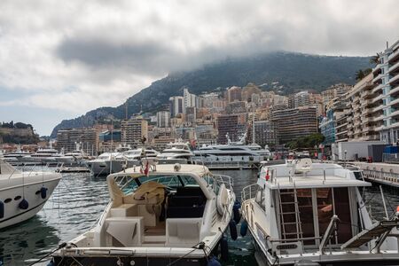 LA CONDAMINE, MONACO - JUNE 04, 2019: Yachts docked at Port Hercules in La Condamine harbour. Cityscape of Monte Carlo. Principality of Monaco.のeditorial素材